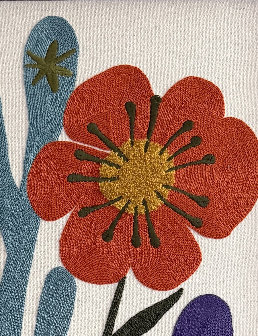 Embroidered orange poppy artwork